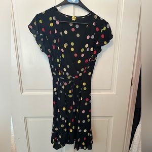 Navy polka dot wrap dress with tie.